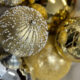 Gold Christmas baubles with glitter detail