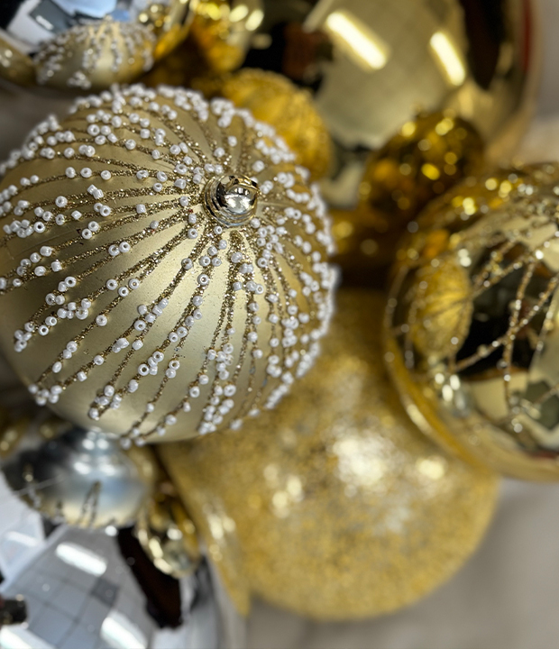 Gold Christmas baubles with glitter detail